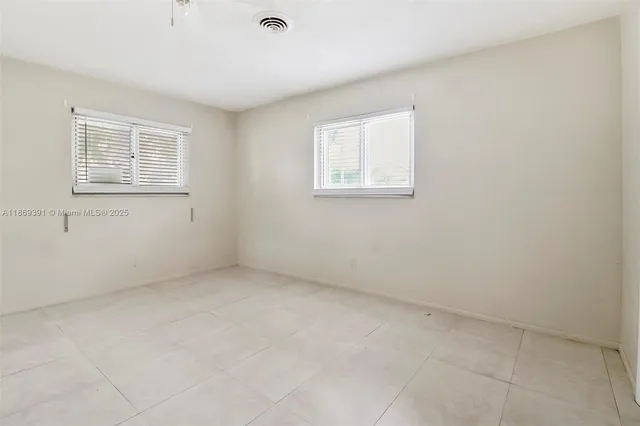 a bathroom with a toilet a sink and a mirror