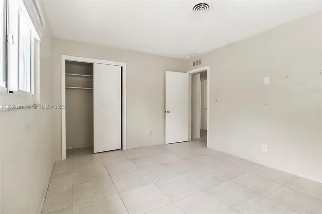 an empty room with glass door