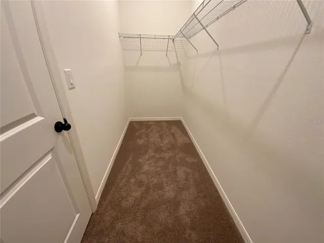 a view of a room with racks on the wall