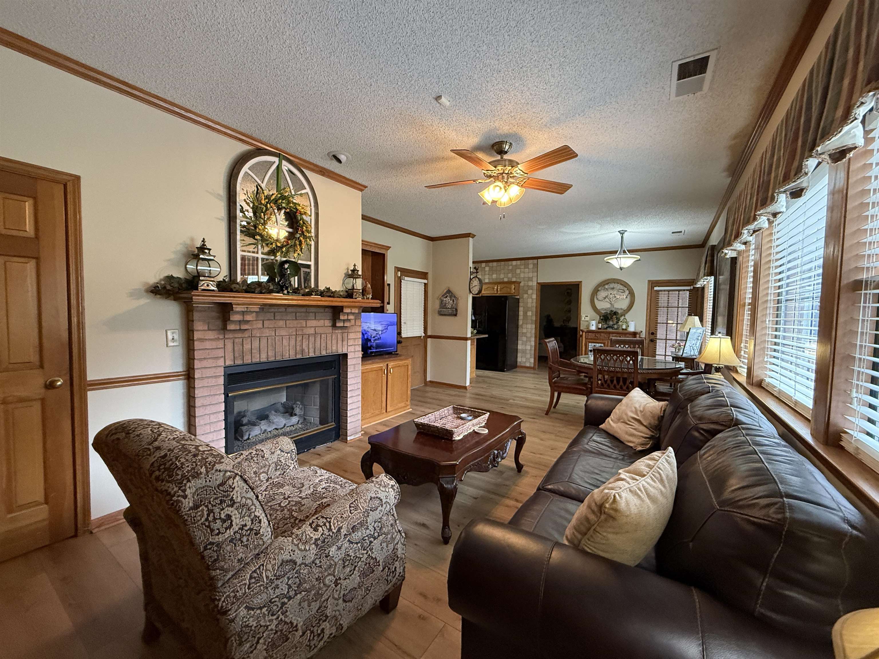 910 Highway 196 Piperton, TN 38017 - Photo 11 of 23 a living room with furniture a fireplace and a large window