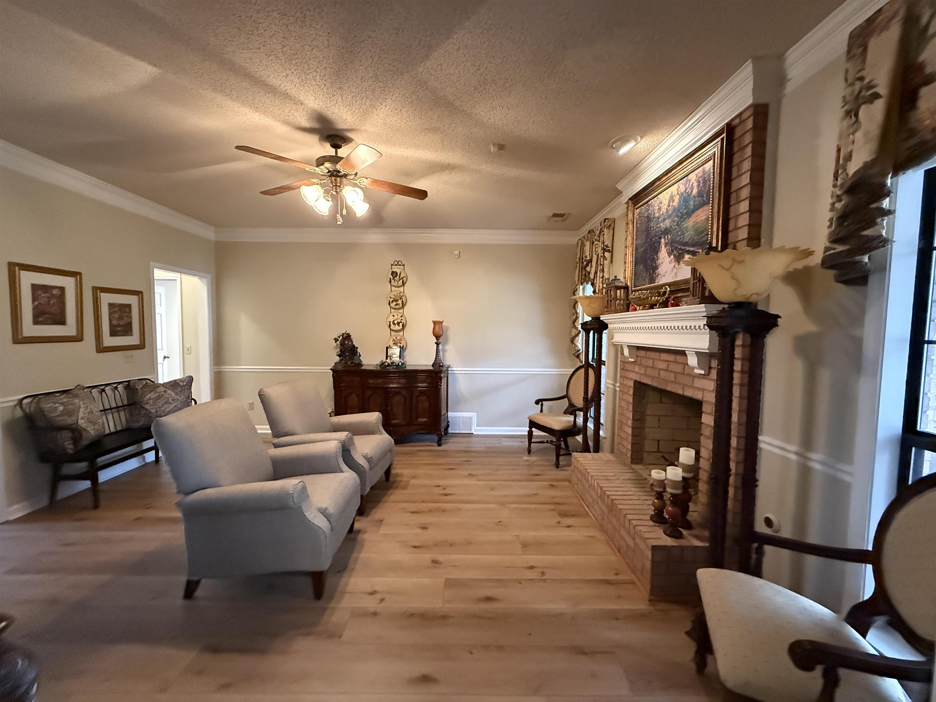 910 Highway 196 Piperton, TN 38017 - Photo 13 of 23 a living room with furniture and a chandelier