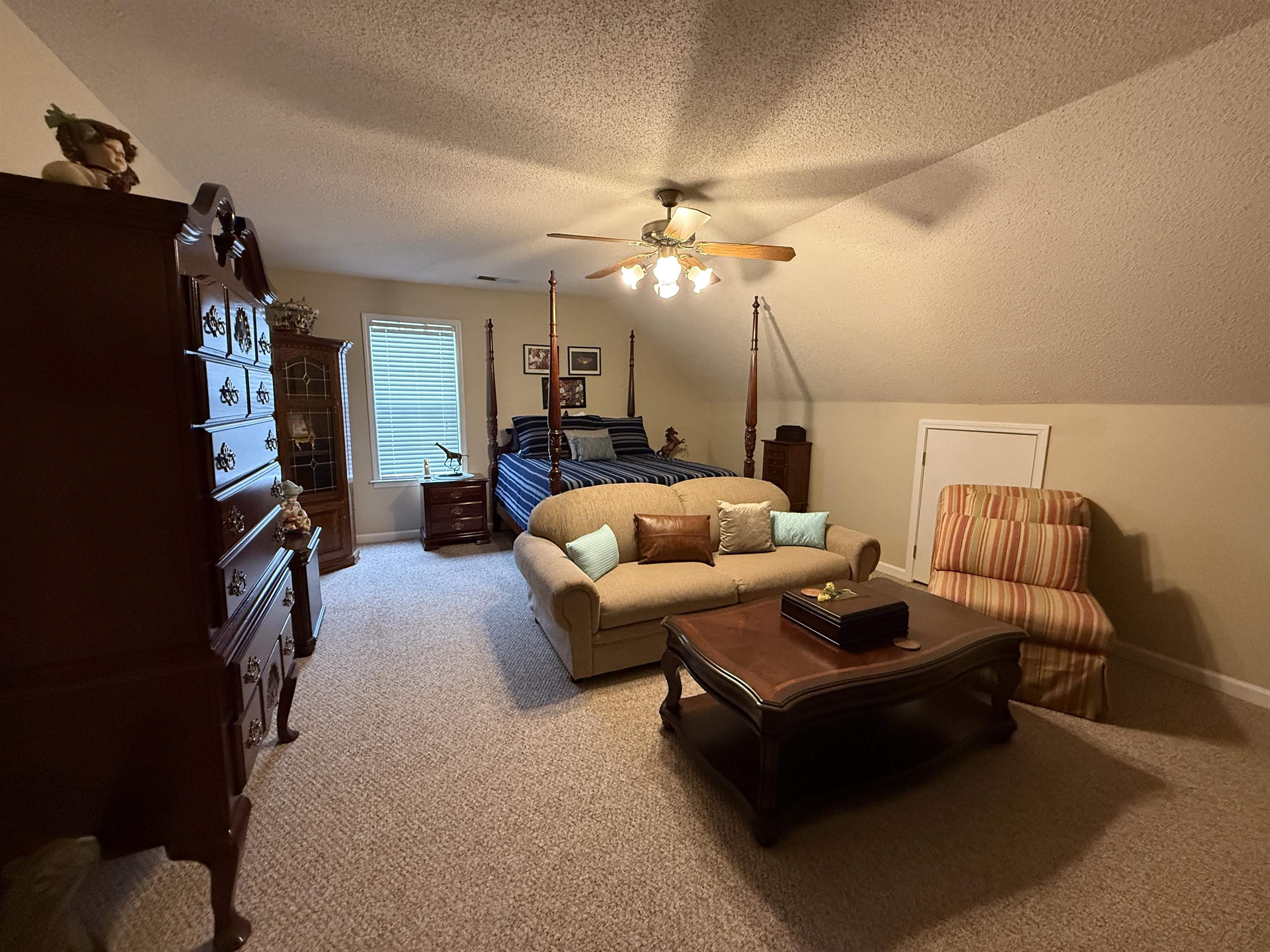 910 Highway 196 Piperton, TN 38017 - Photo 18 of 23 a living room with furniture a ceiling fan and a rug