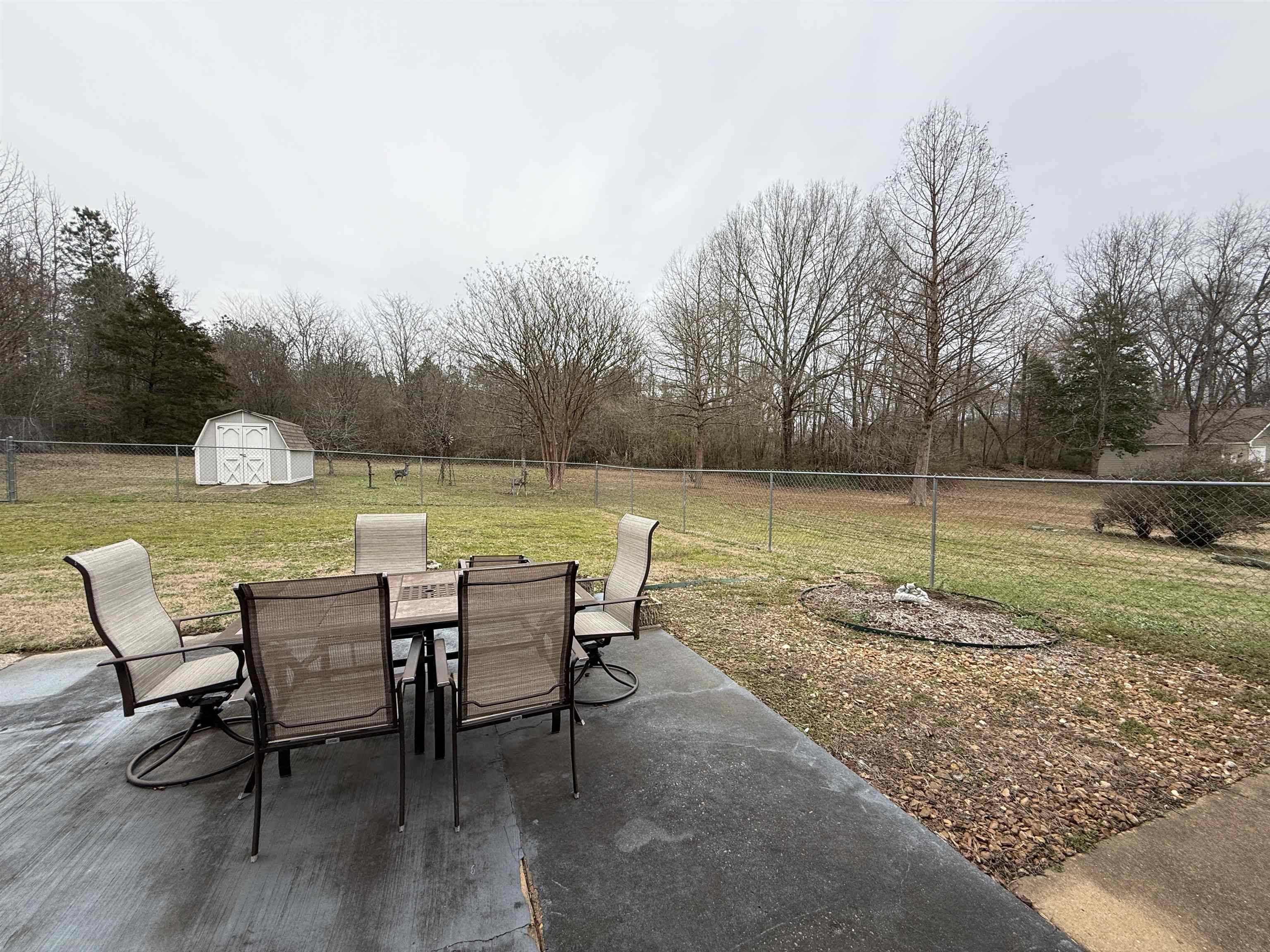 910 Highway 196 Piperton, TN 38017 - Photo 20 of 23 a view of a lake with table and chairs