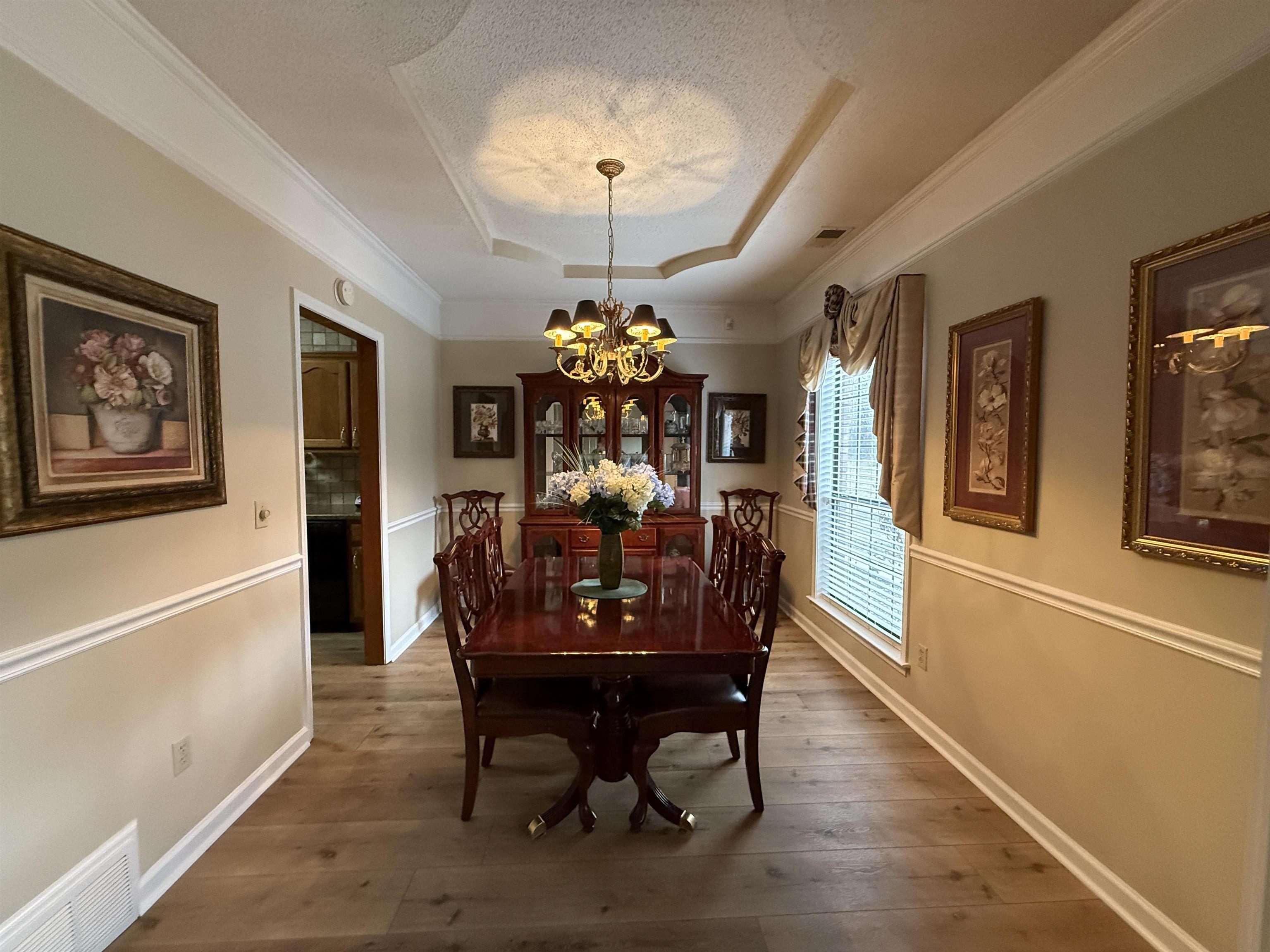 910 Highway 196 Piperton, TN 38017 - Photo 3 of 23 a view of a dining room with furniture and chandelier