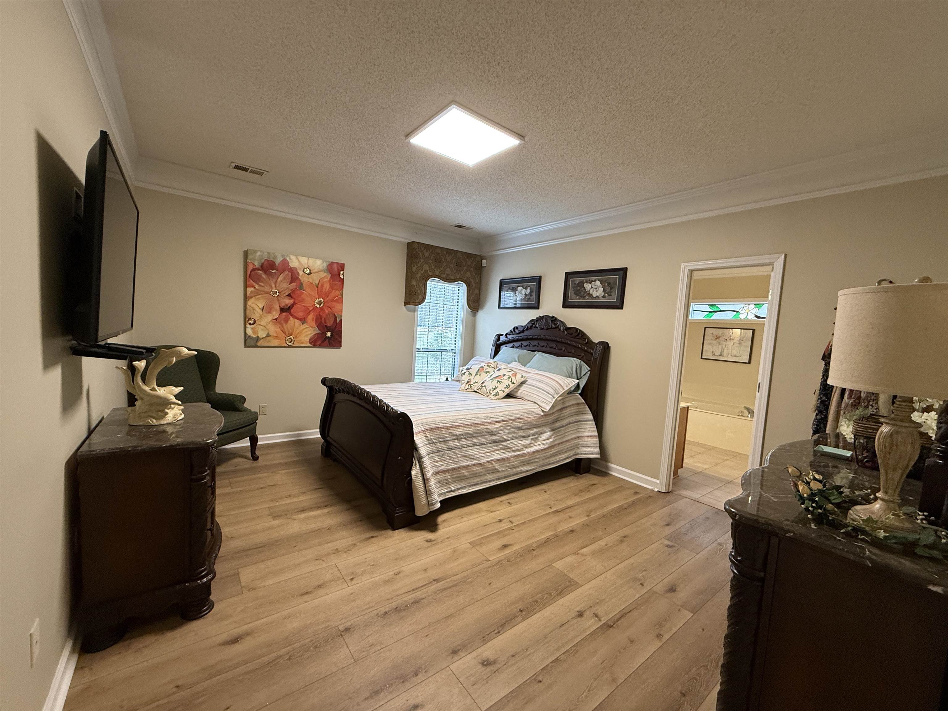 910 Highway 196 Piperton, TN 38017 - Photo 4 of 23 a bedroom with a bed and dresser