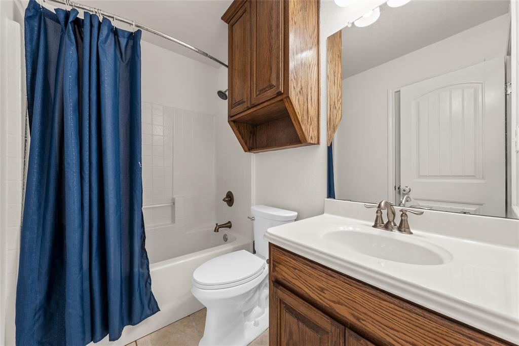 109 Ruby Circle Hewitt, TX 76643 - Photo 12 of 14 a bathroom with a sink a toilet and shower