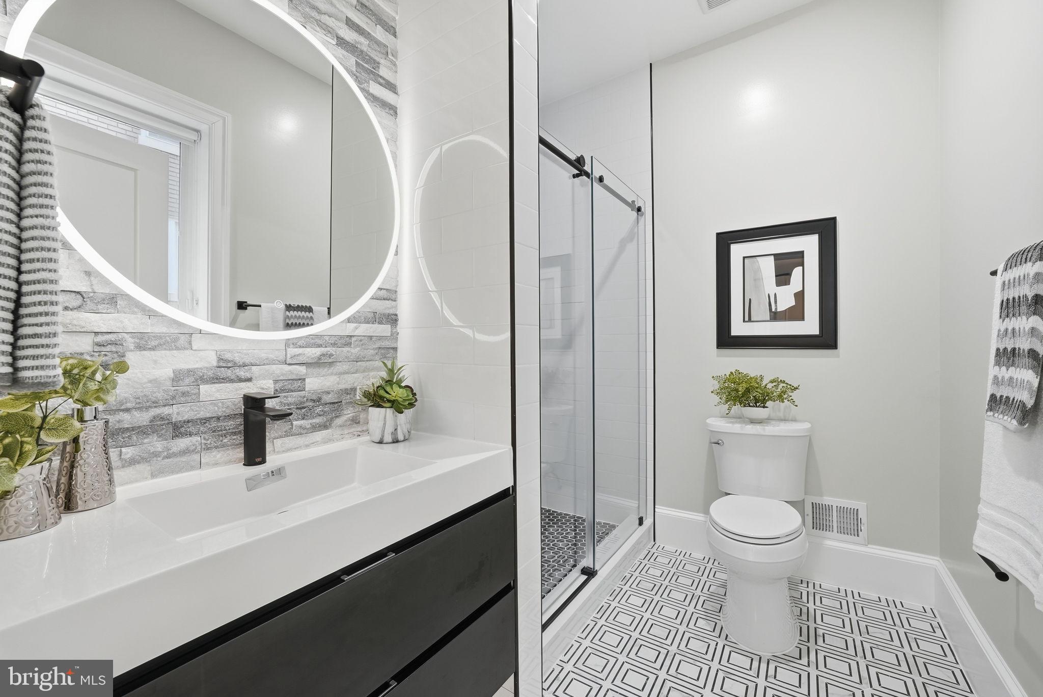 5315 Colorado Avenue Northwest Washington, DC 20011 - Photo 29 of 67 a bathroom with a sink a toilet and a mirror