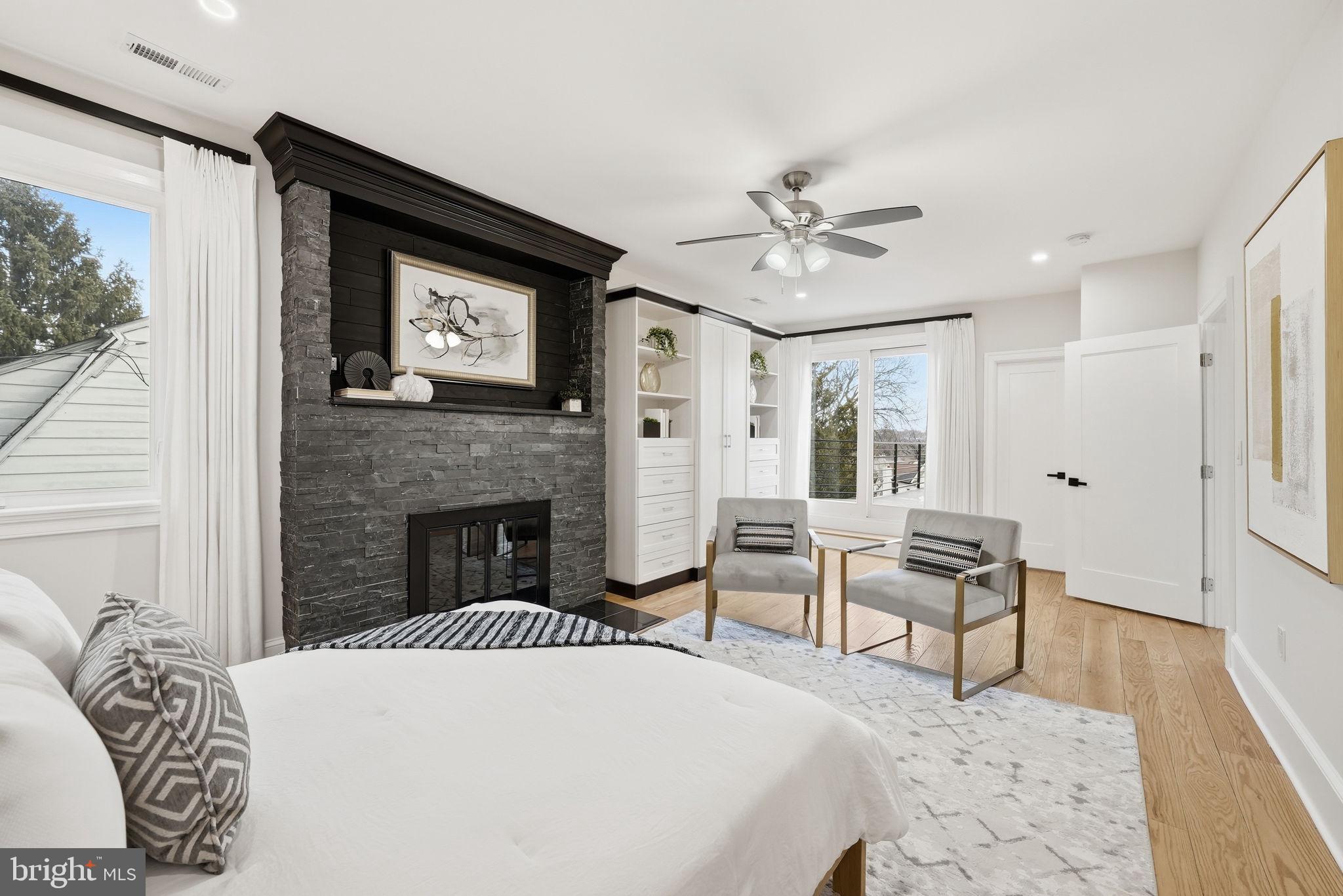 5315 Colorado Avenue Northwest Washington, DC 20011 - Photo 41 of 67 a spacious bedroom with a bed and a fireplace