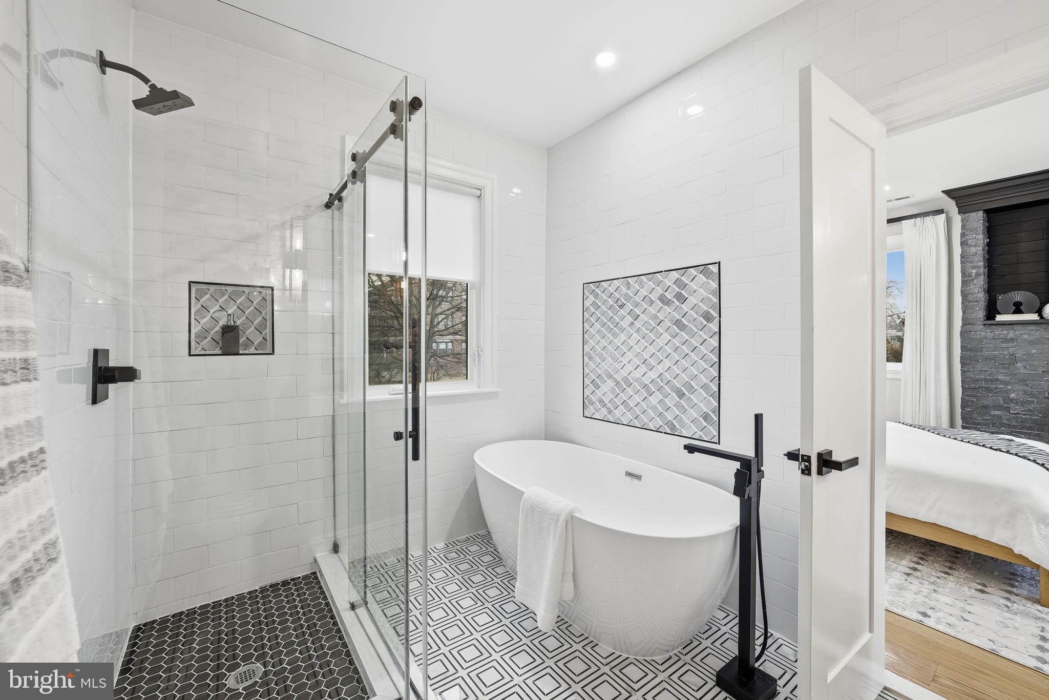 5315 Colorado Avenue Northwest Washington, DC 20011 - Photo 44 of 67 a bathroom with a sink a toilet a glass door shower and a mirror