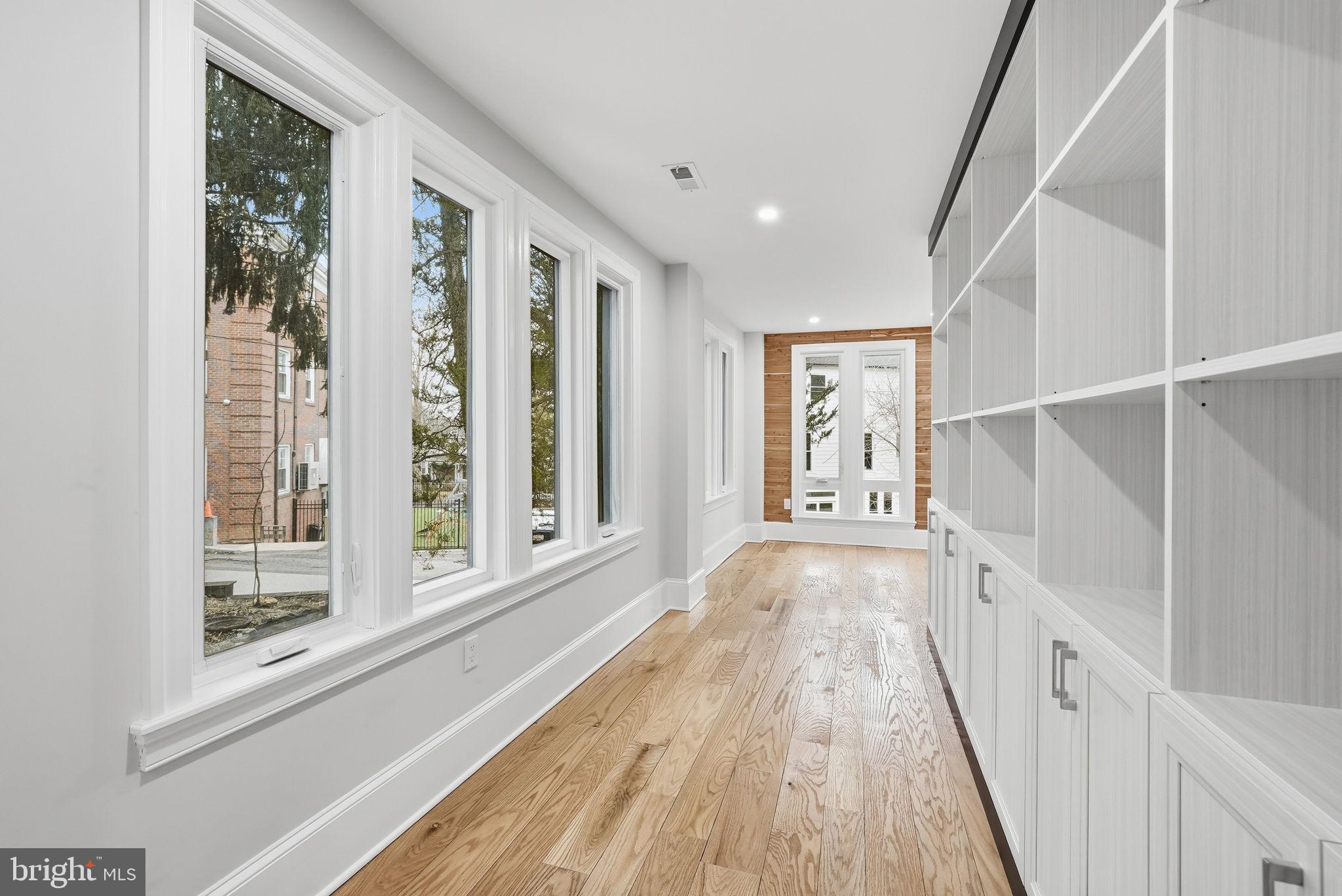 5315 Colorado Avenue Northwest Washington, DC 20011 - Photo 50 of 67 a view of a hallway with wooden floor and windows