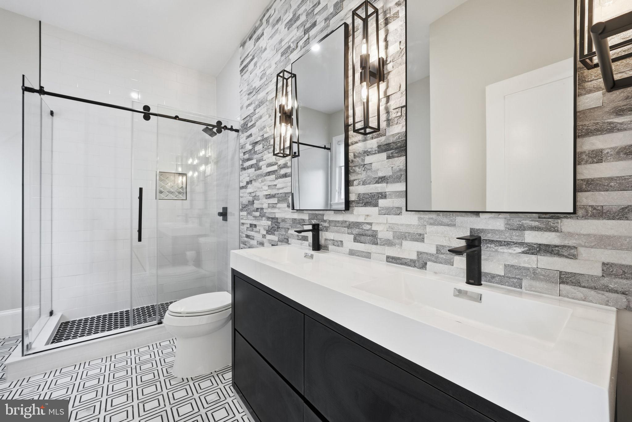 5315 Colorado Avenue Northwest Washington, DC 20011 - Photo 6 of 67 a bathroom with a sink a toilet and shower