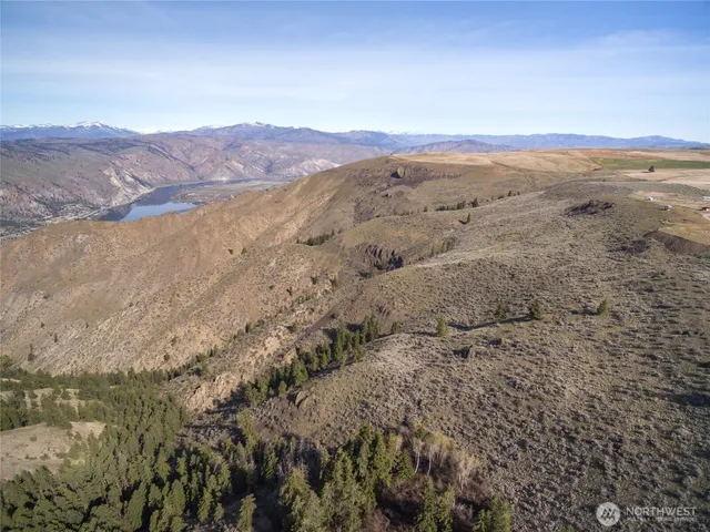 a view of mountain with an ocean