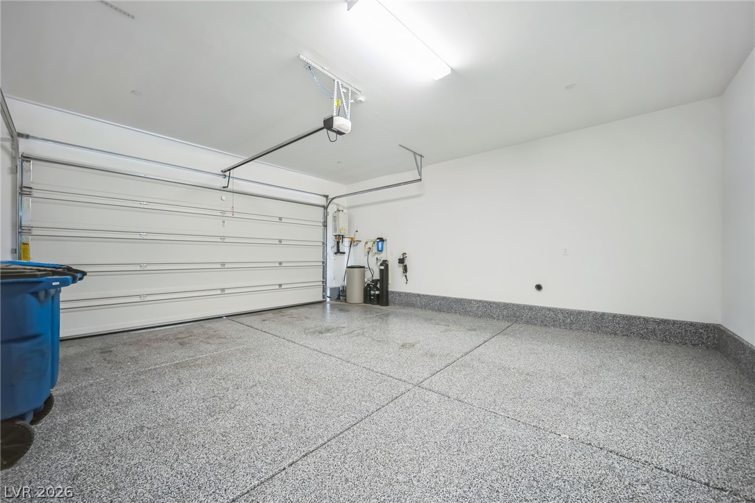 7348 North Decatur Boulevard, Unit 1 North Las Vegas, NV 89084 - Photo 17 of 17 A pristine garage with a clean, speckled epoxy floor and ample space awaits your vehicles.