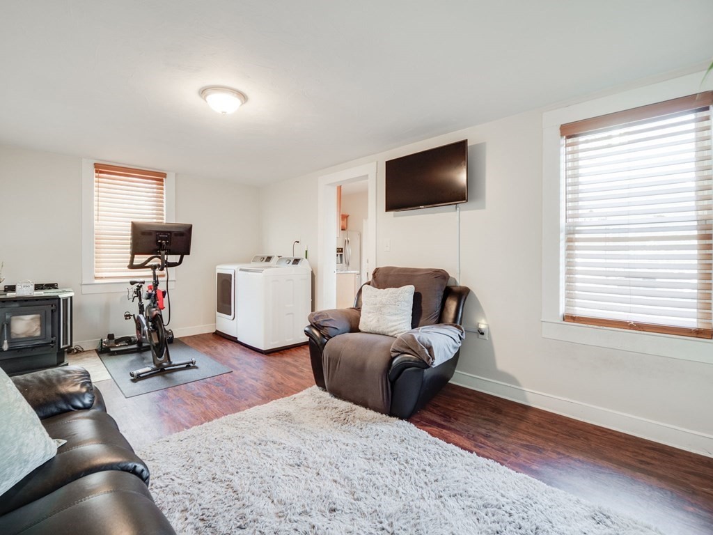 116 Middlesex Road Tyngsborough, MA 01879 - Photo 14 of 42 a living room with furniture flat screen tv and windows