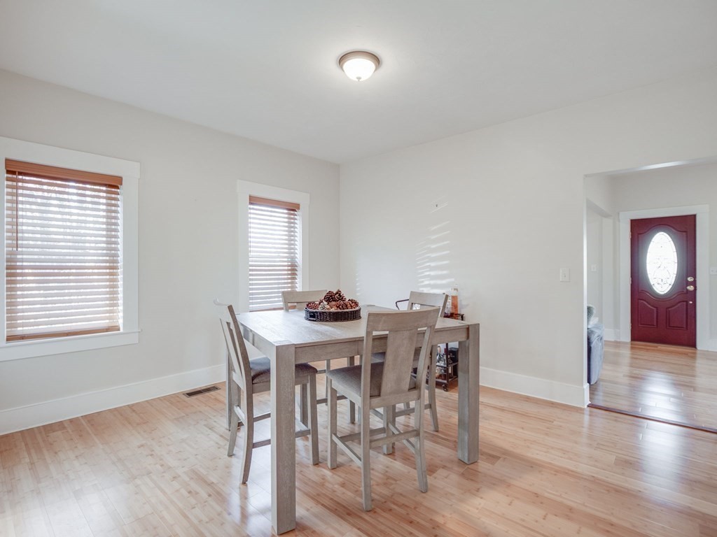 116 Middlesex Road Tyngsborough, MA 01879 - Photo 18 of 42 a view of a dining room with furniture and wooden floor