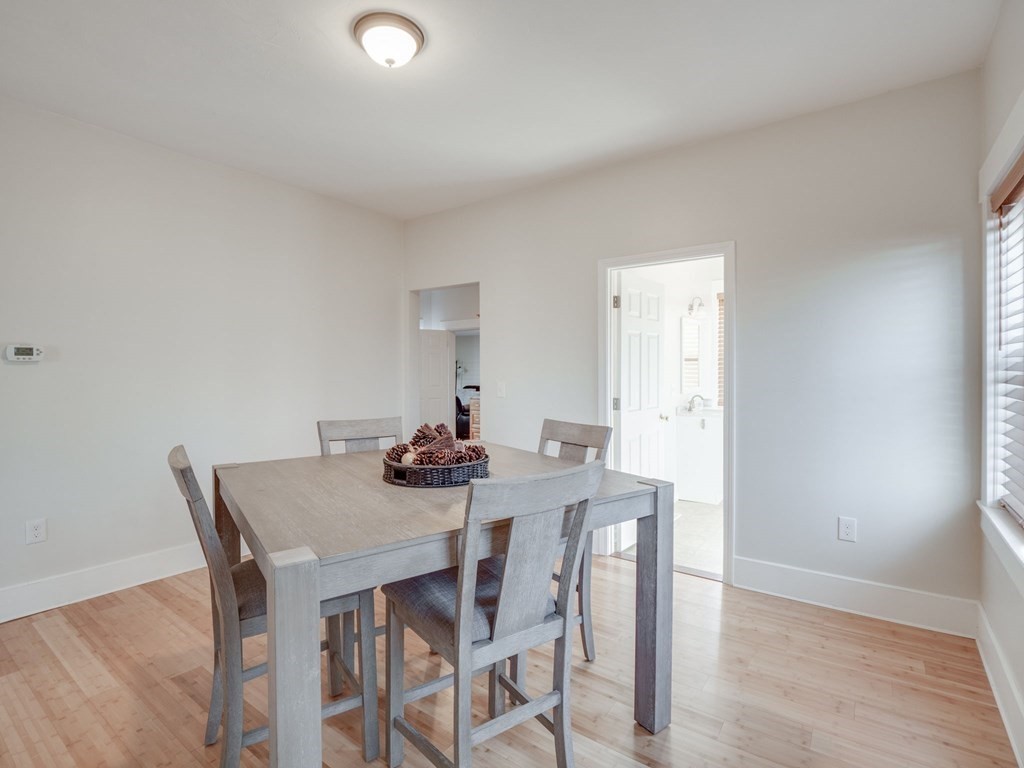116 Middlesex Road Tyngsborough, MA 01879 - Photo 19 of 42 a view of a dining room with furniture and wooden floor
