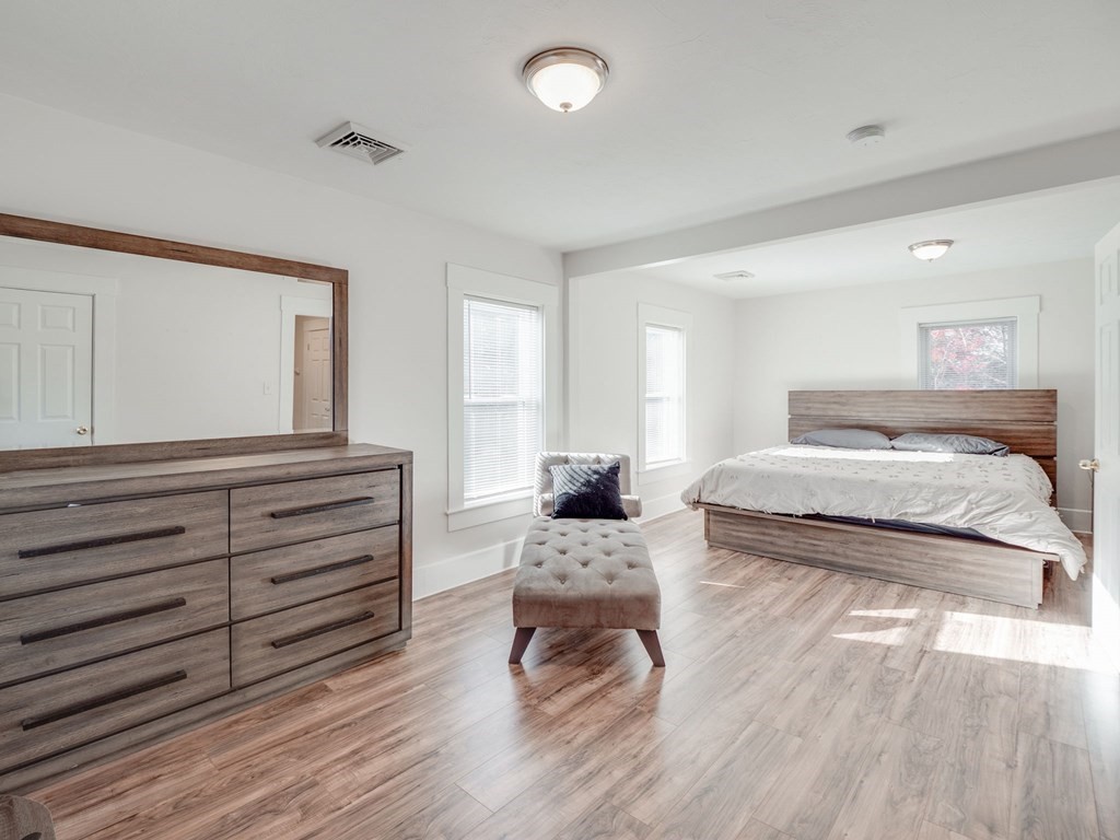 116 Middlesex Road Tyngsborough, MA 01879 - Photo 23 of 42 a bedroom with a bed and a dresser