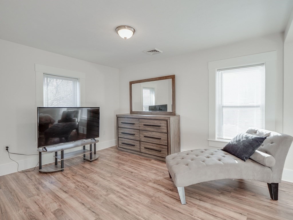 116 Middlesex Road Tyngsborough, MA 01879 - Photo 25 of 42 a bedroom with furniture and flat screen tv