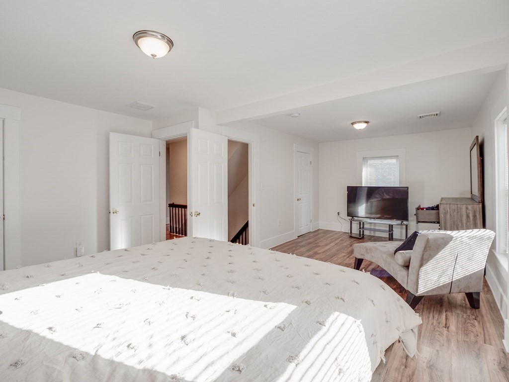 116 Middlesex Road Tyngsborough, MA 01879 - Photo 26 of 42 a bedroom with a bed and a flat screen tv