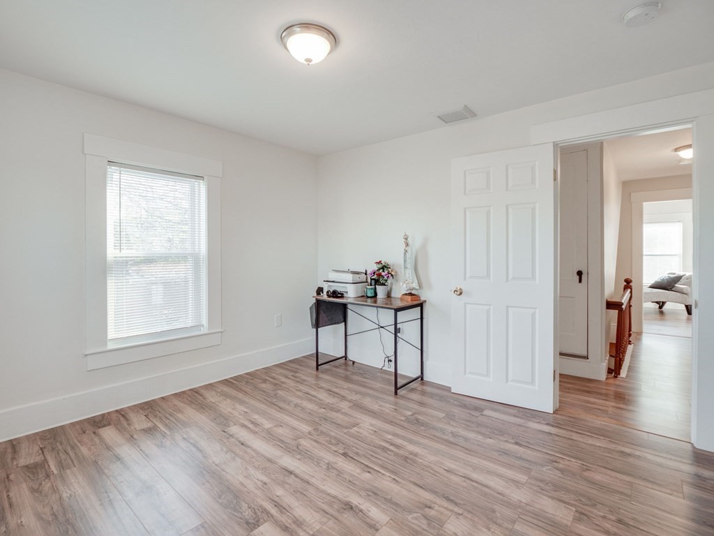 116 Middlesex Road Tyngsborough, MA 01879 - Photo 28 of 42 a view of a livingroom with wooden floor and a window