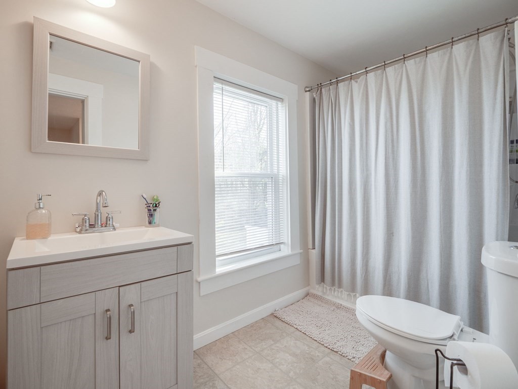 116 Middlesex Road Tyngsborough, MA 01879 - Photo 31 of 42 a bathroom with a sink a toilet and tub