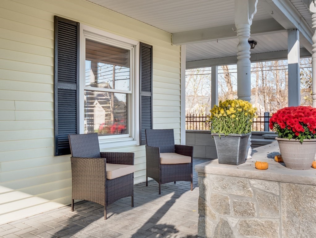 116 Middlesex Road Tyngsborough, MA 01879 - Photo 32 of 42 a living room filled with furniture and a potted plant