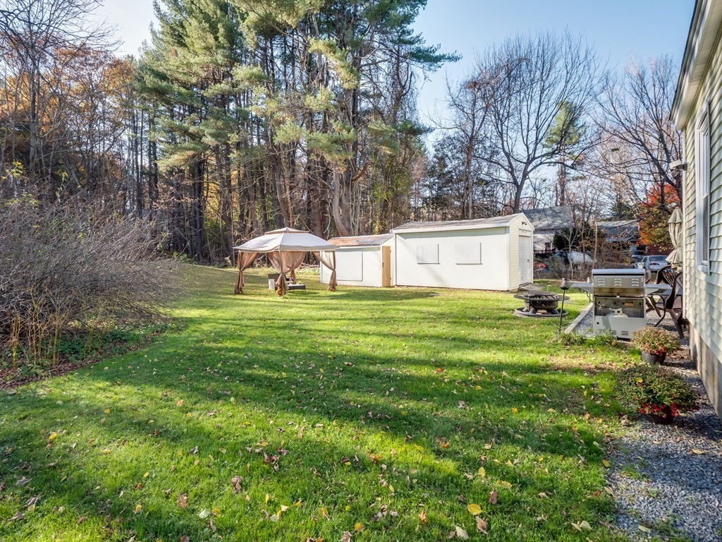 116 Middlesex Road Tyngsborough, MA 01879 - Photo 33 of 42 a view of a house with a yard and sitting area