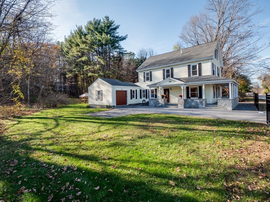 116 Middlesex Road Tyngsborough, MA 01879 - Photo 40 of 42 a house with swimming pool in front of it