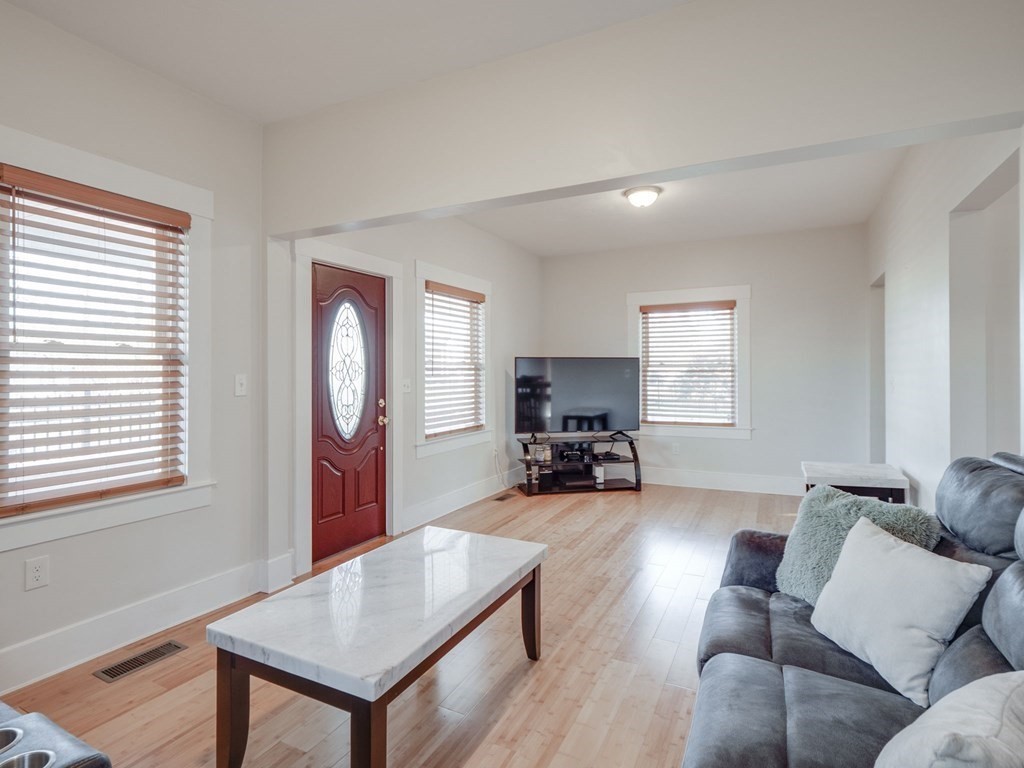 116 Middlesex Road Tyngsborough, MA 01879 - Photo 9 of 42 a view of a livingroom with furniture and a window