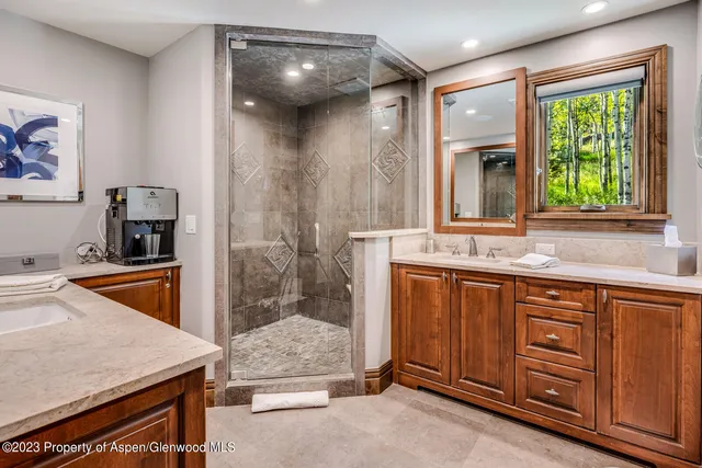 a bathroom with a sink double vanity and a bathtub
