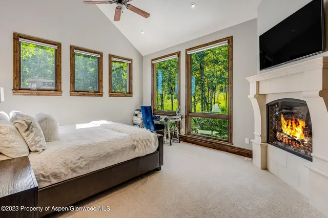 a bed sitting in a room next to a window