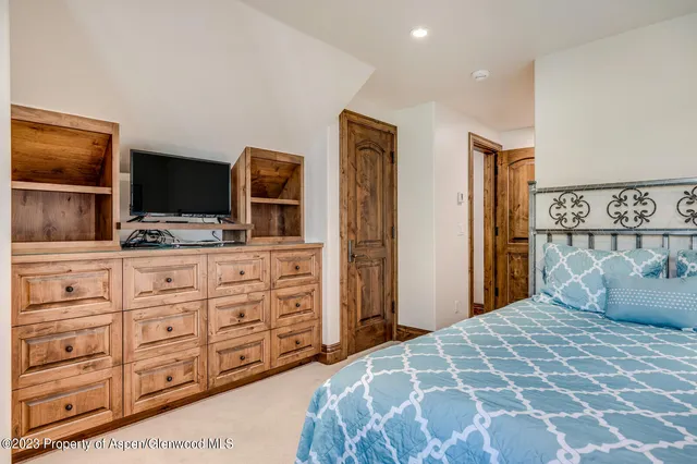 a bedroom with a bed and walk in closet