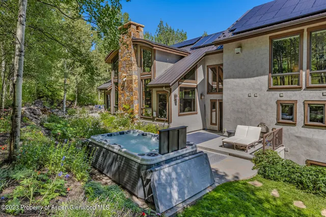 front view of a house with a chairs