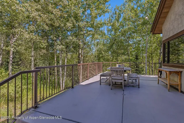 a view of a balcony with chairs