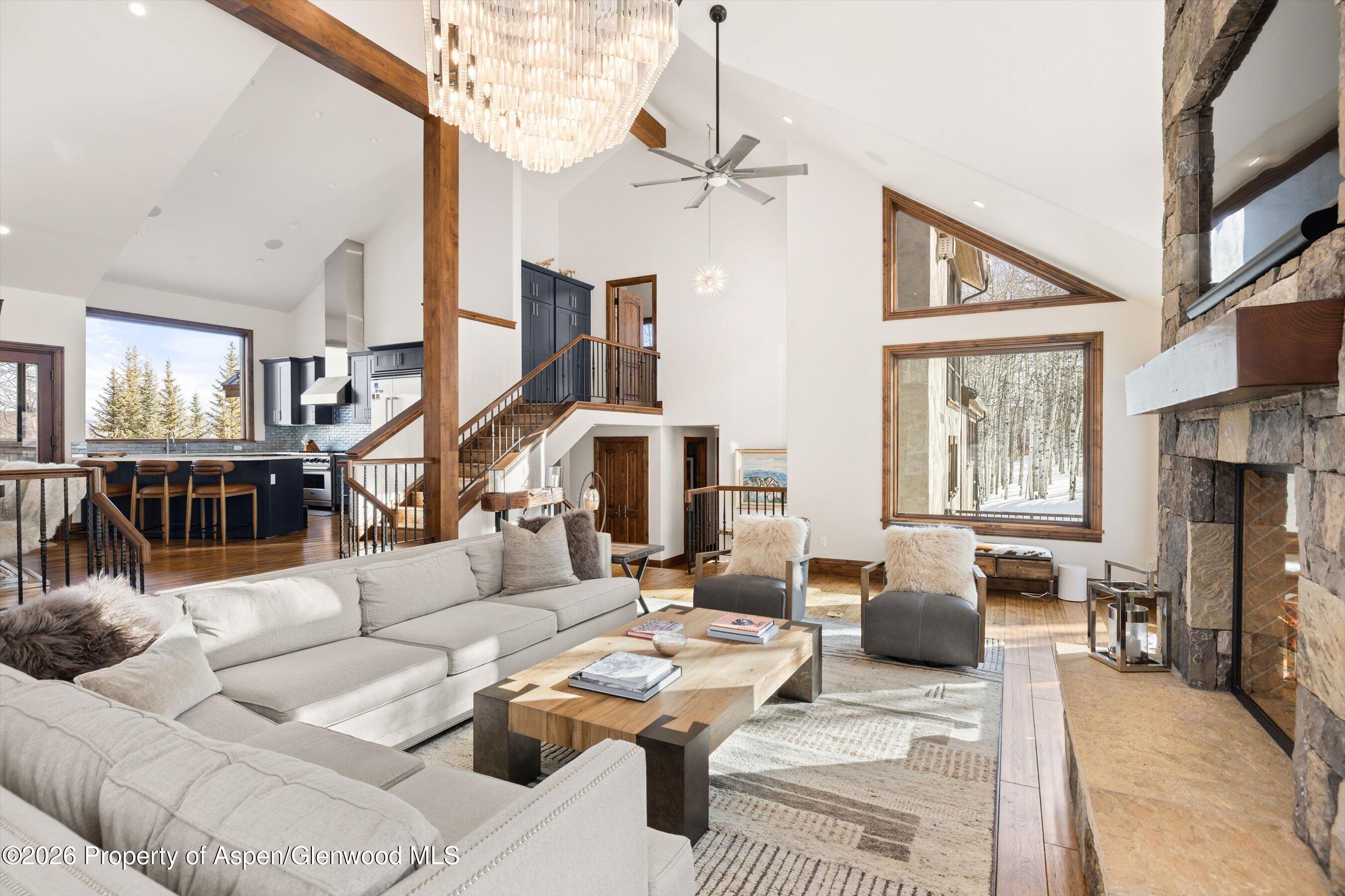 435 Faraway Road Snowmass Village, CO 81615 - Photo 7 of 35 a living room with furniture fireplace and a flat screen tv