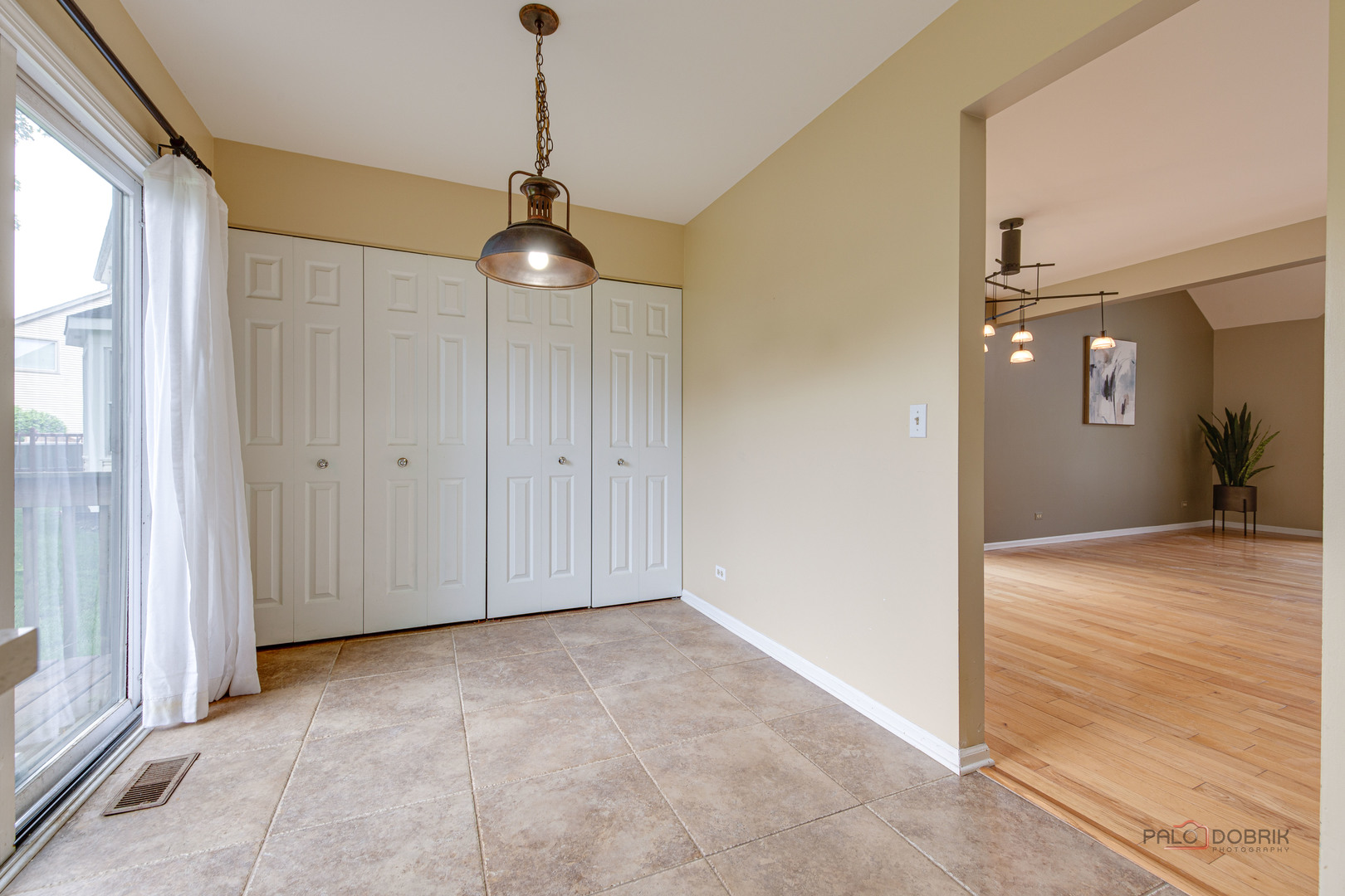 621 Raintree Road Buffalo Grove, IL 60089 - Photo 21 of 46 a view of empty room with wooden floor and fan