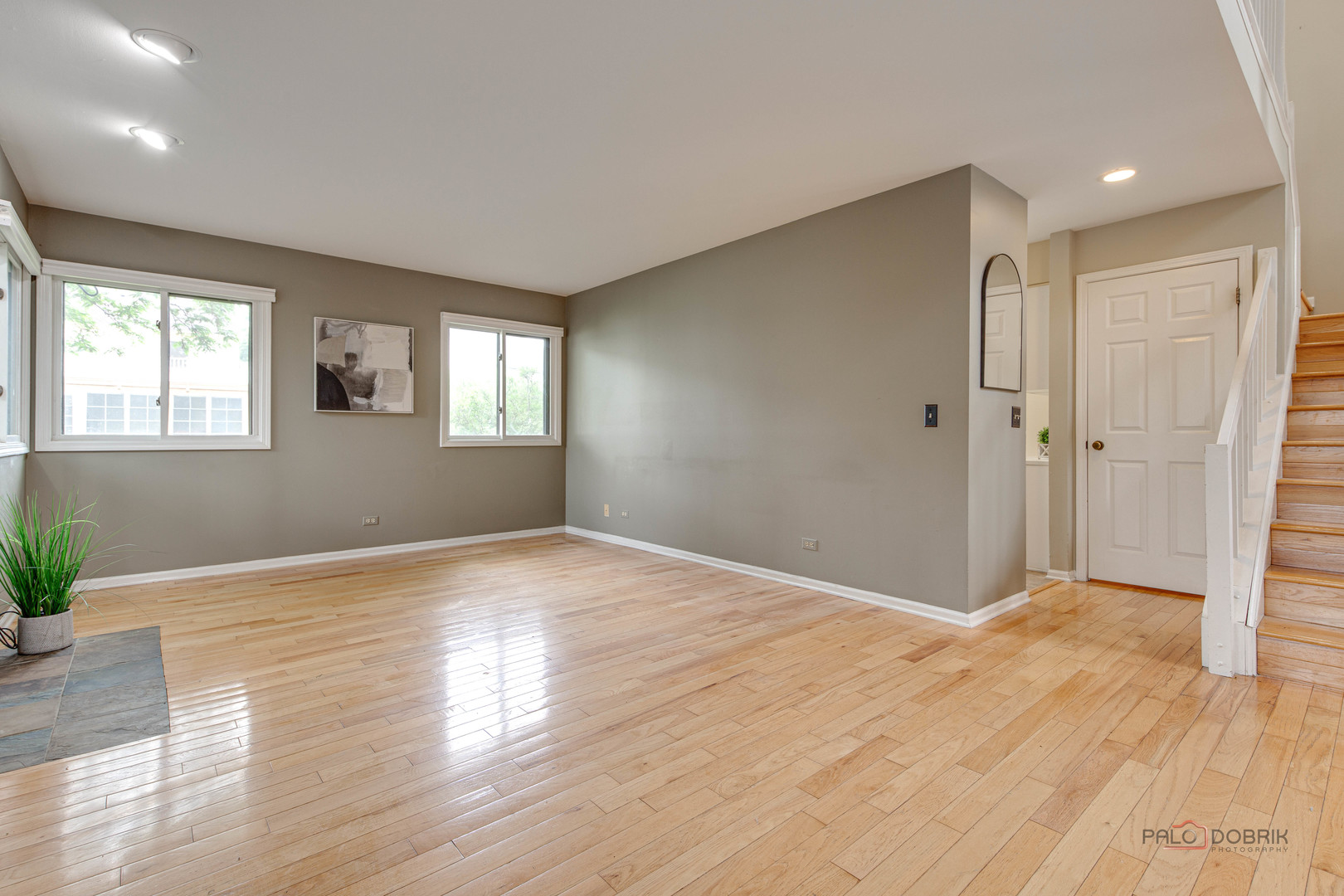 621 Raintree Road Buffalo Grove, IL 60089 - Photo 7 of 46 a view of empty room with wooden floor and fan