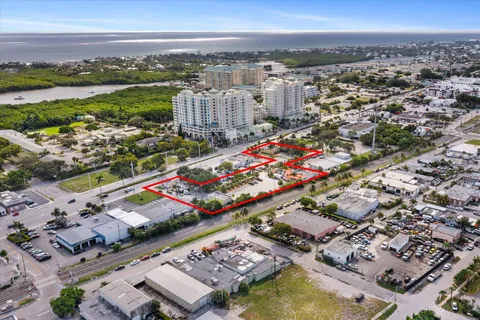 an aerial view of multiple house with yard