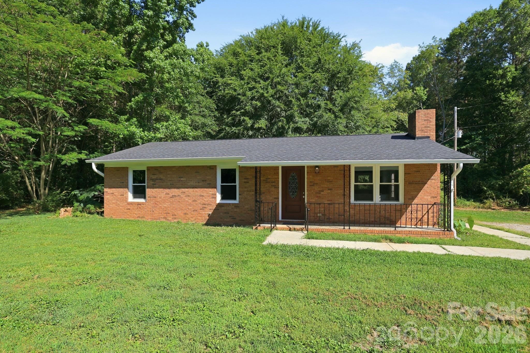 1108 Willoughby Road Monroe, NC 28110 - Photo 2 of 48 front view of a house with a yard