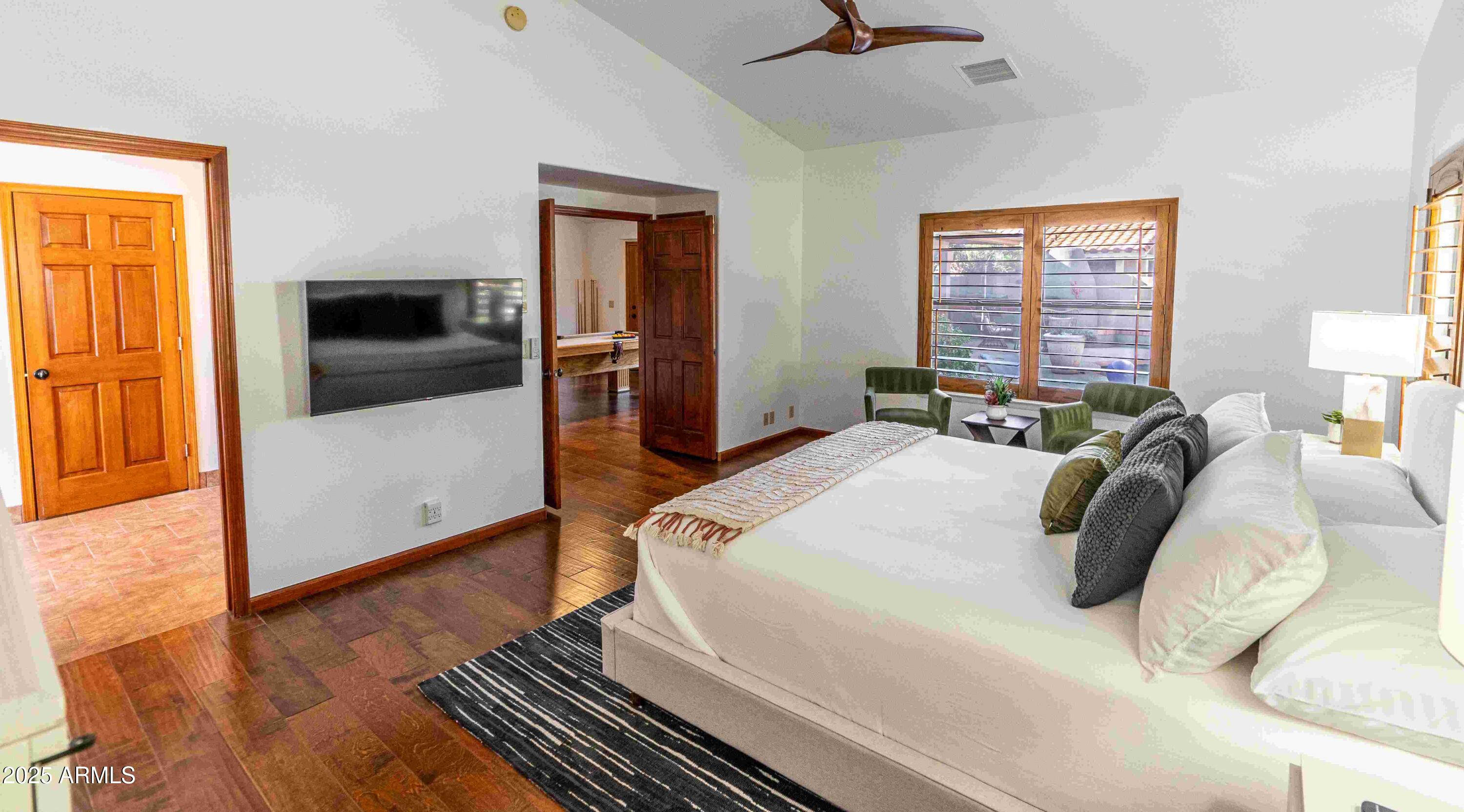 5426 East Libby Street Scottsdale, AZ 85254 - Photo 13 of 29 a bed sitting in a bedroom next to a window