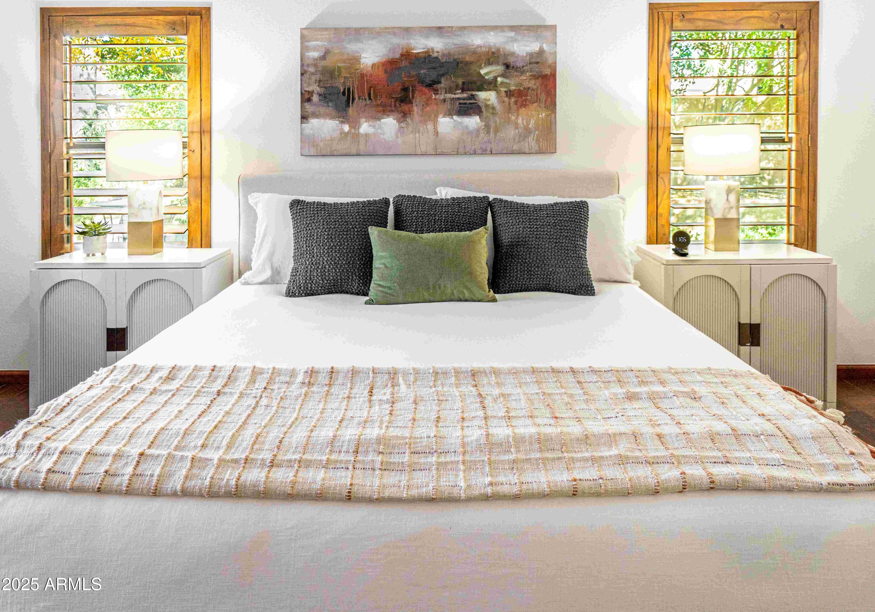 5426 East Libby Street Scottsdale, AZ 85254 - Photo 14 of 29 a large white bed sitting in a bedroom next to a window