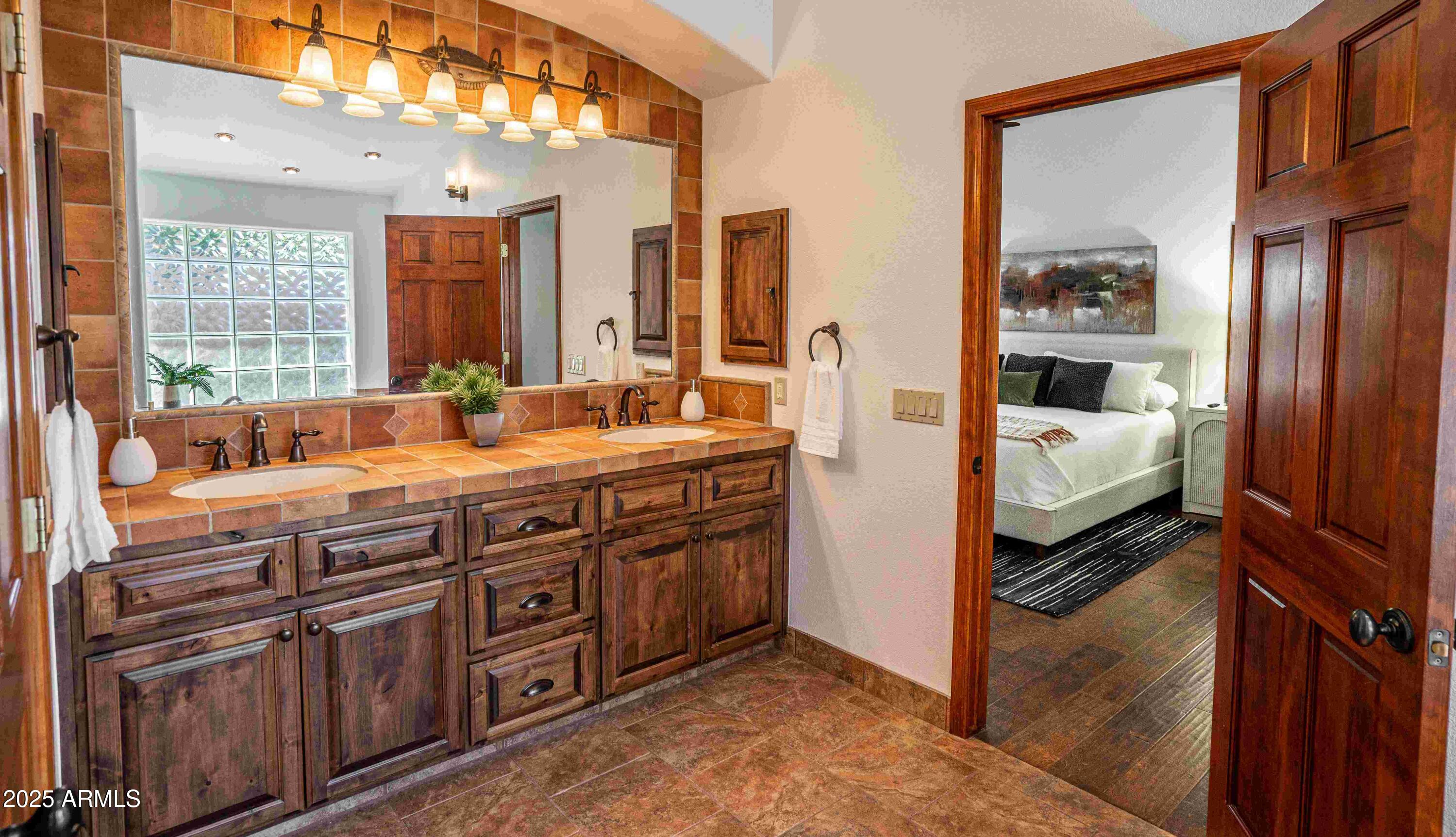 5426 East Libby Street Scottsdale, AZ 85254 - Photo 17 of 29 a en suite bathroom with a double vanity sink and a mirror