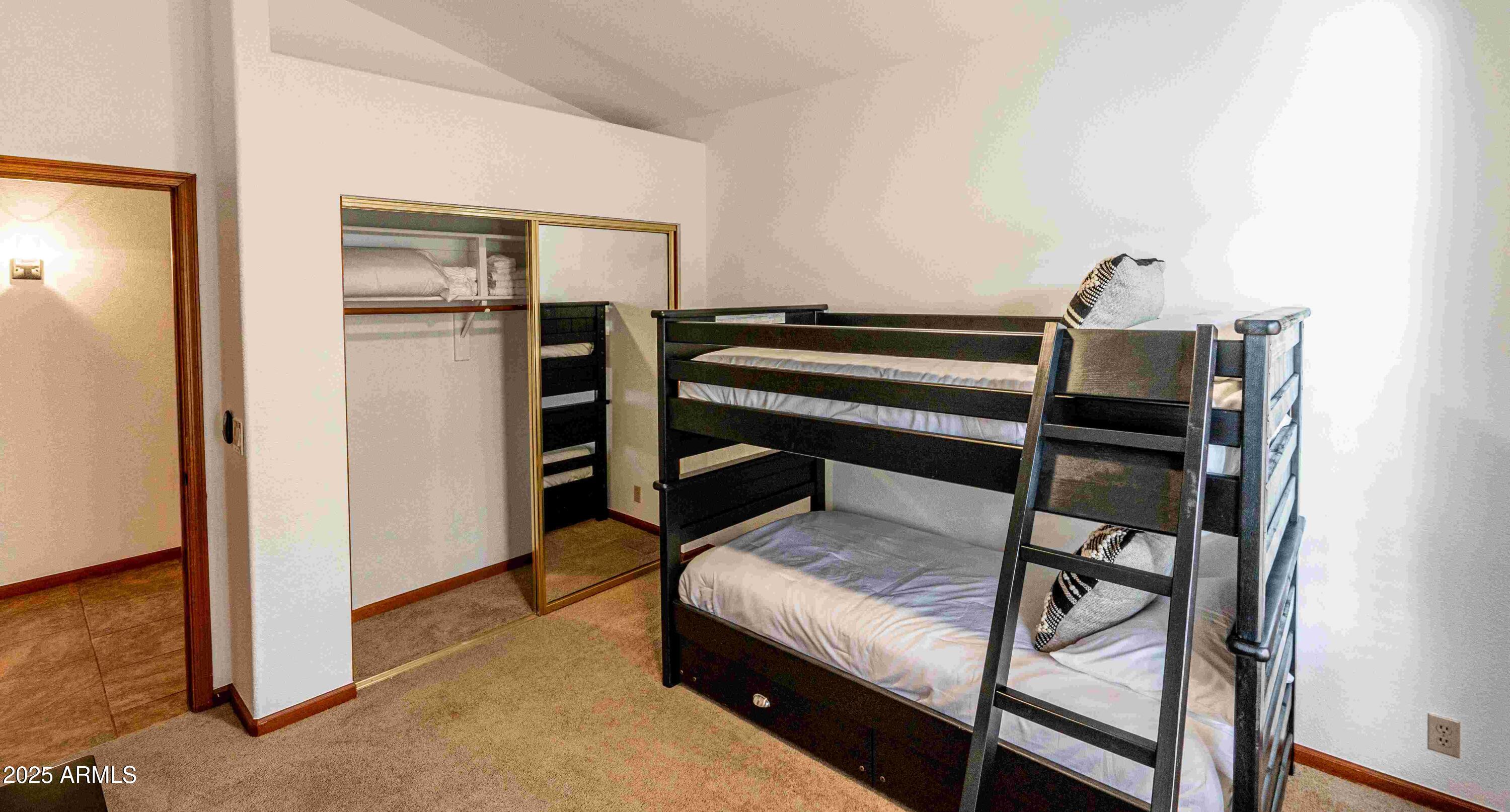 5426 East Libby Street Scottsdale, AZ 85254 - Photo 22 of 29 a bedroom with a bunk bed and a dresser