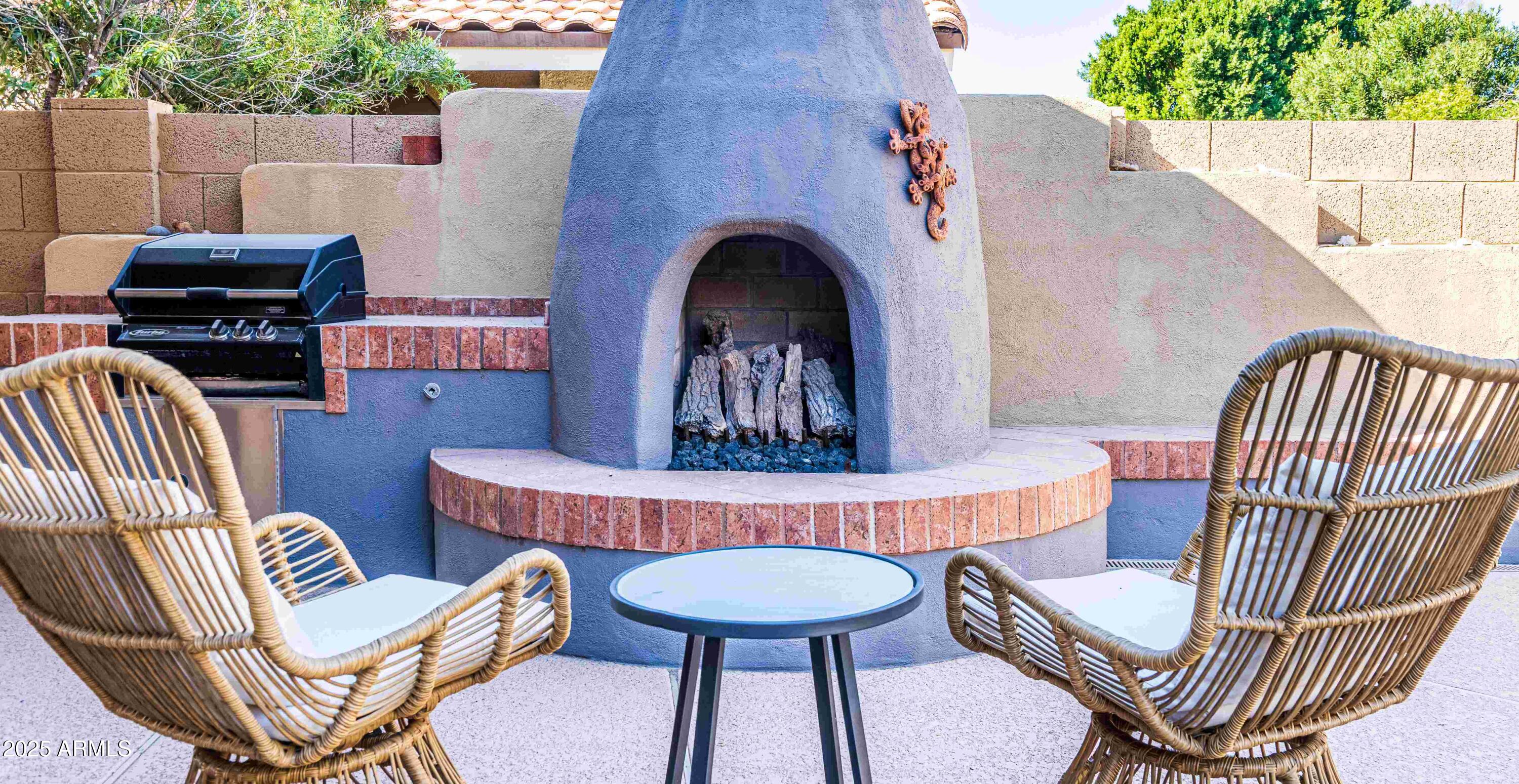 5426 East Libby Street Scottsdale, AZ 85254 - Photo 28 of 29 a outdoor living space with furniture and a fireplace