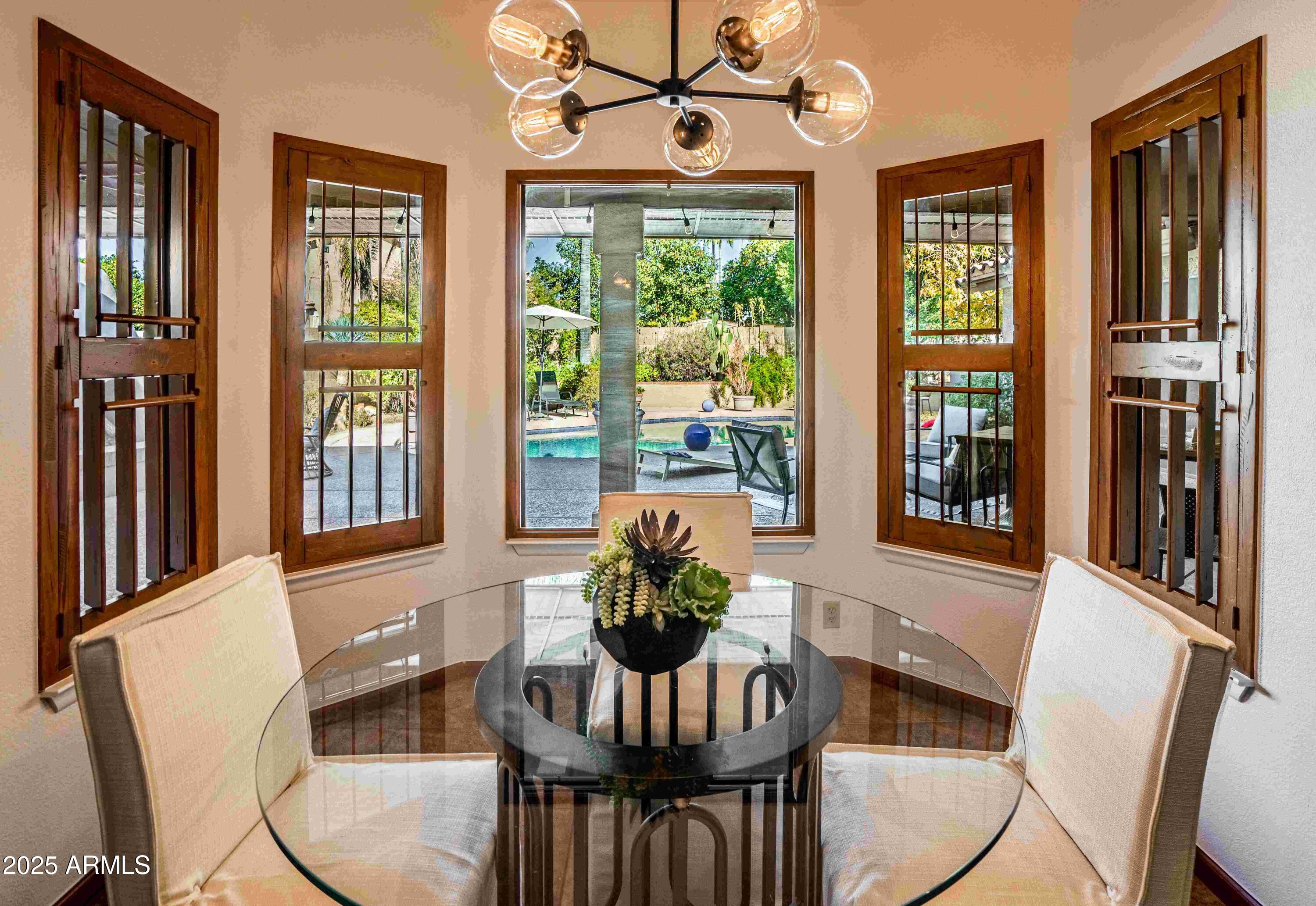 5426 East Libby Street Scottsdale, AZ 85254 - Photo 7 of 29 a dining room with furniture window wooden floor