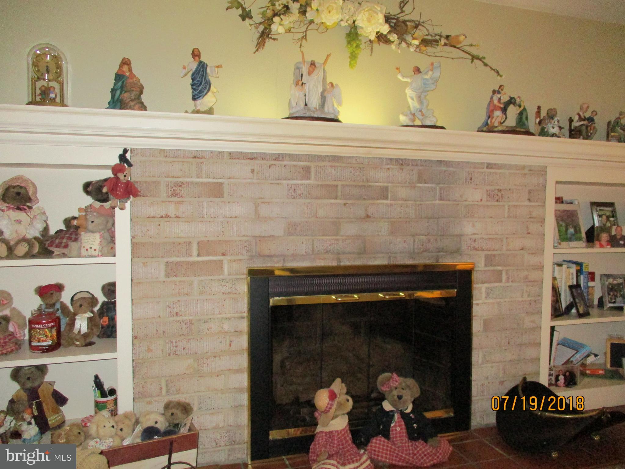1781 Sapphire Road York, PA 17408 - Photo 13 of 38 Gas FP with brick surround and hearth