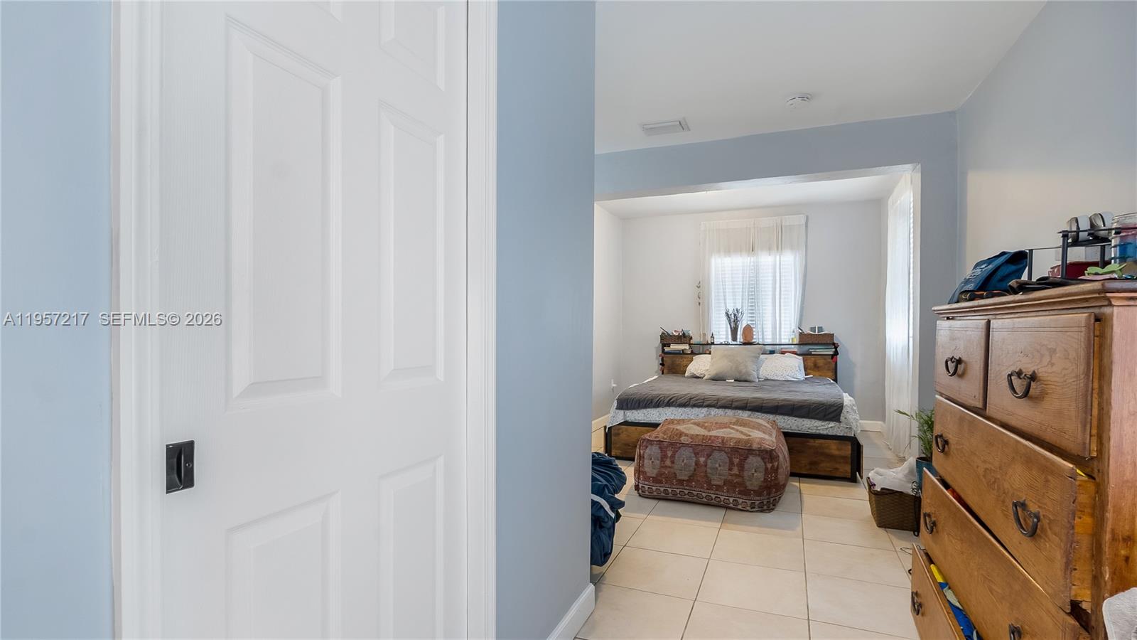 491 Northwest 108th Terrace Miami, FL 33168 - Photo 20 of 37 a bedroom with a bed and a mirror