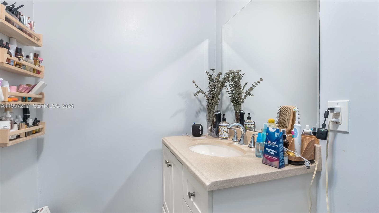 491 Northwest 108th Terrace Miami, FL 33168 - Photo 22 of 37 a bathroom with a sink and a mirror