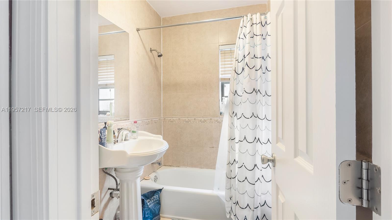 491 Northwest 108th Terrace Miami, FL 33168 - Photo 24 of 37 a bathroom with a sink a toilet and shower