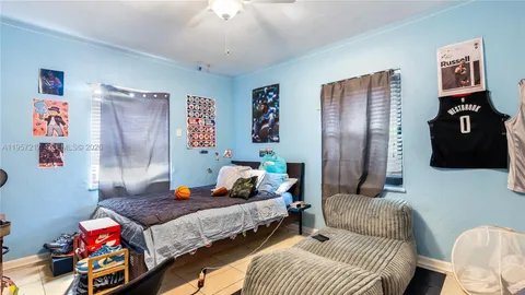 a bedroom with a bed and furniture